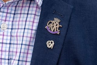 A man wearing GRRC and GSA badges at Goodwood Festival of Speed.Picture date: Thursday July 8, 2021..Photograph by Christopher Ison ©.07544044177.chris@christopherison.com.www.christopherison.com..IMPORTANT NOTE REGARDING IMAGE LICENCING FOR THIS PHOTOGRAPH: This image is supplied to the client under the terms previously agree. No sales are permitted unless expressly agreed in writing by the photographer.