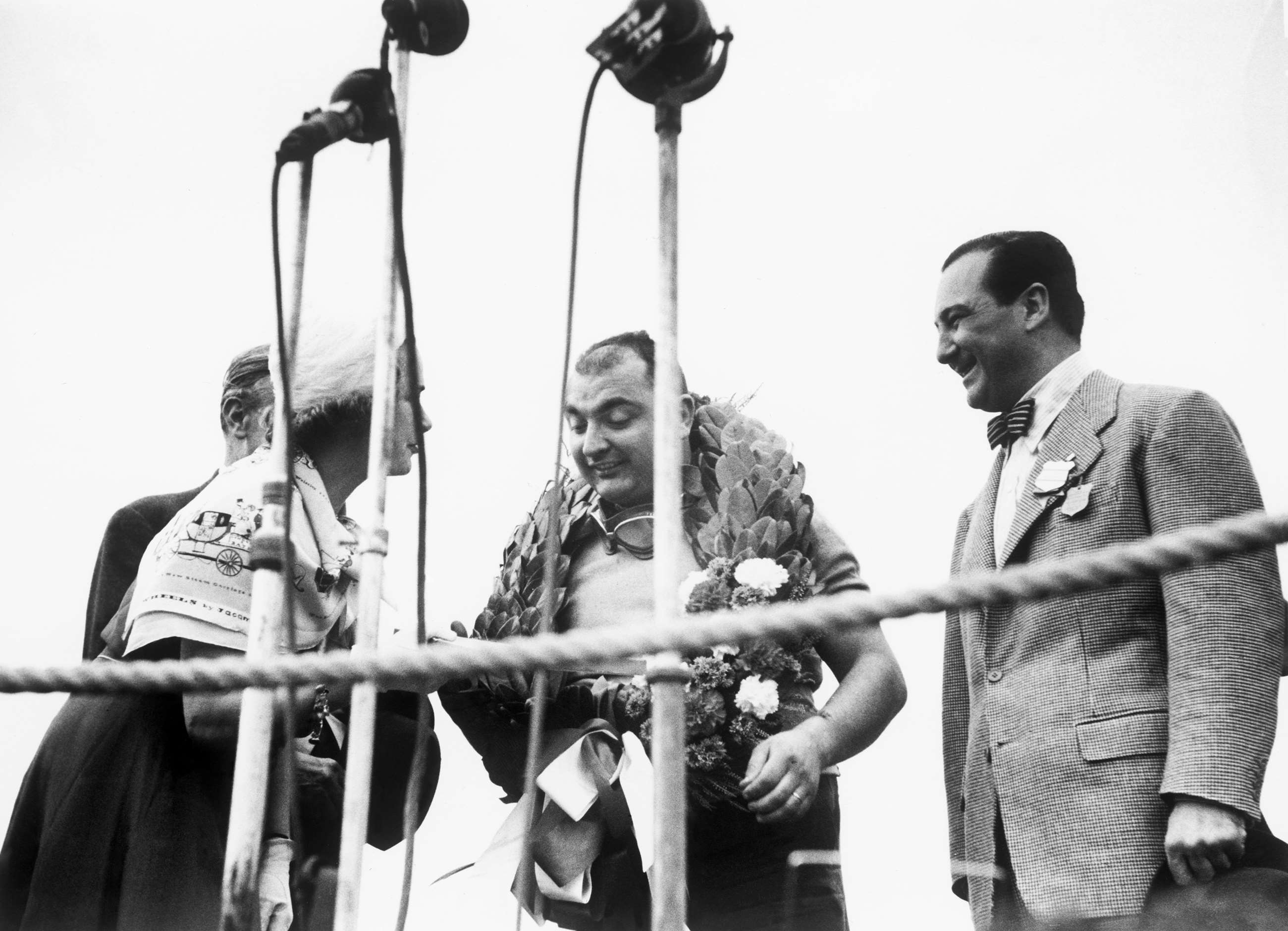 f1-1951-silverstone-jose-froilan-gonzalez-podium-queen-mother-lat-motorsport-images-goodwood-12072019.jpg