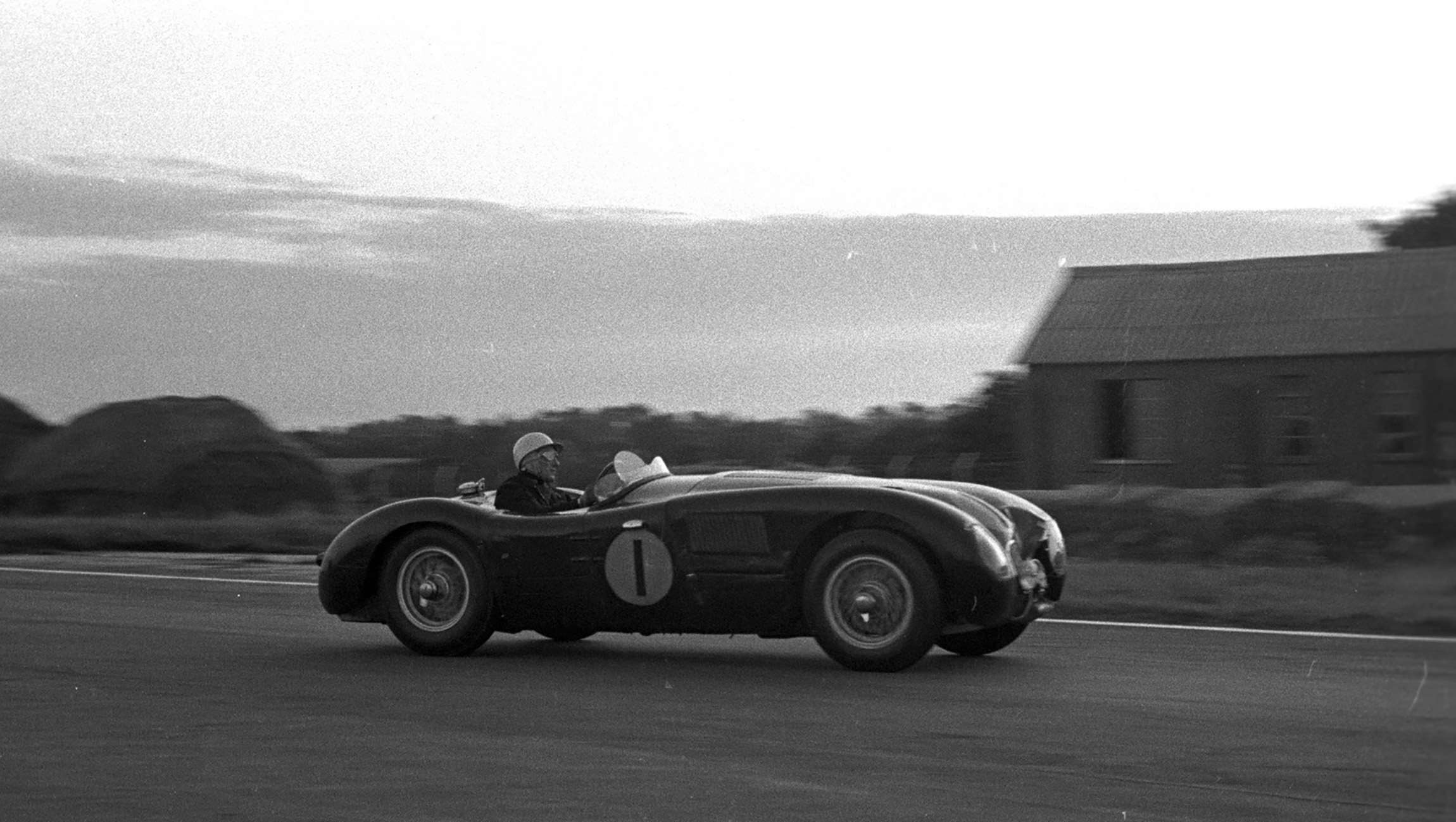 Dusk at Goodwood in an earlier era - Moss, works Jaguar C-Type, in the 1953 9-Hours…