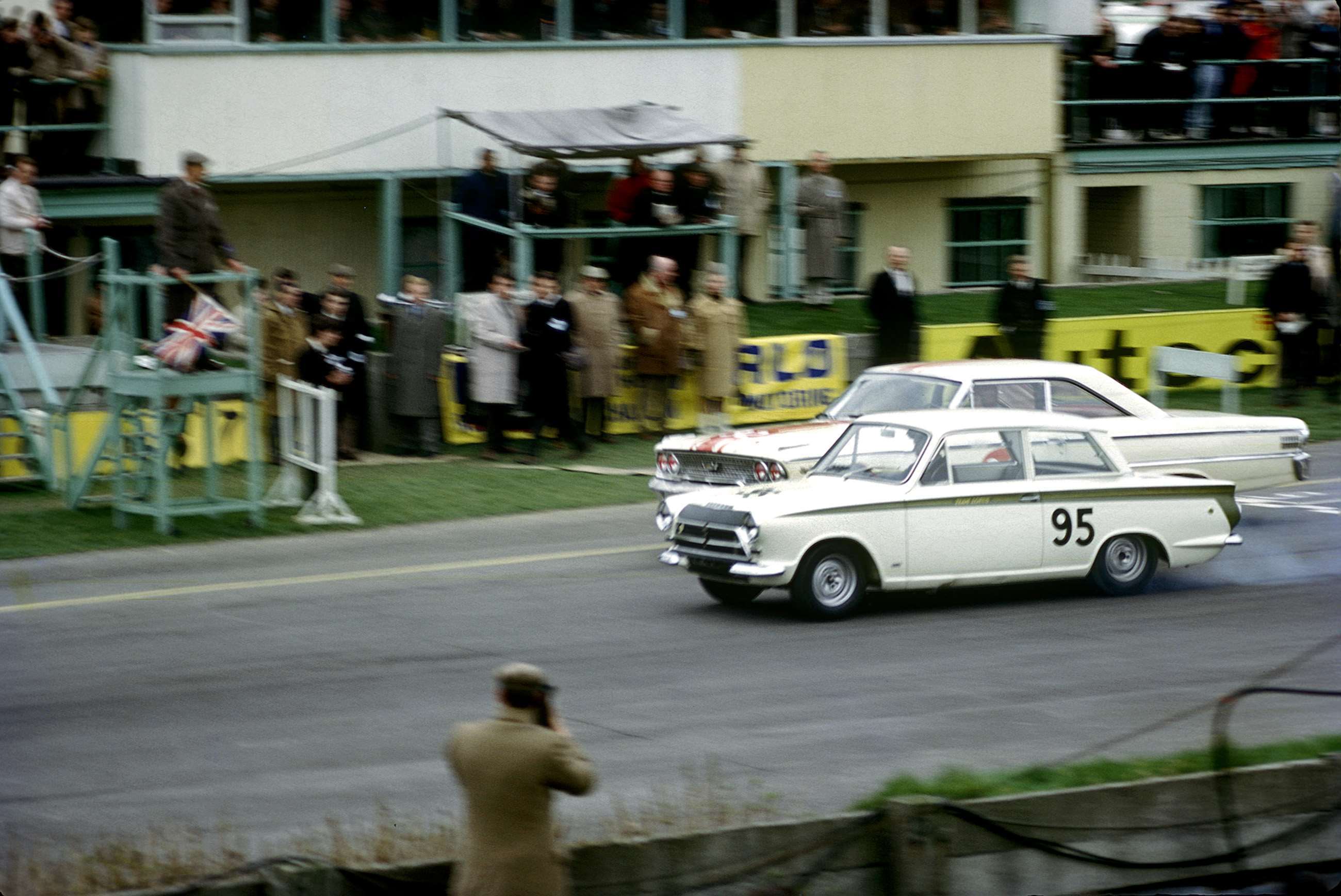 Easter Monday Goodwood 1964 - Jim Clark’s Lotus-Cortina just gets the drop on Jack Sears’ Willment Galaxie at the start of a truly memorable Goodwood saloon car race.