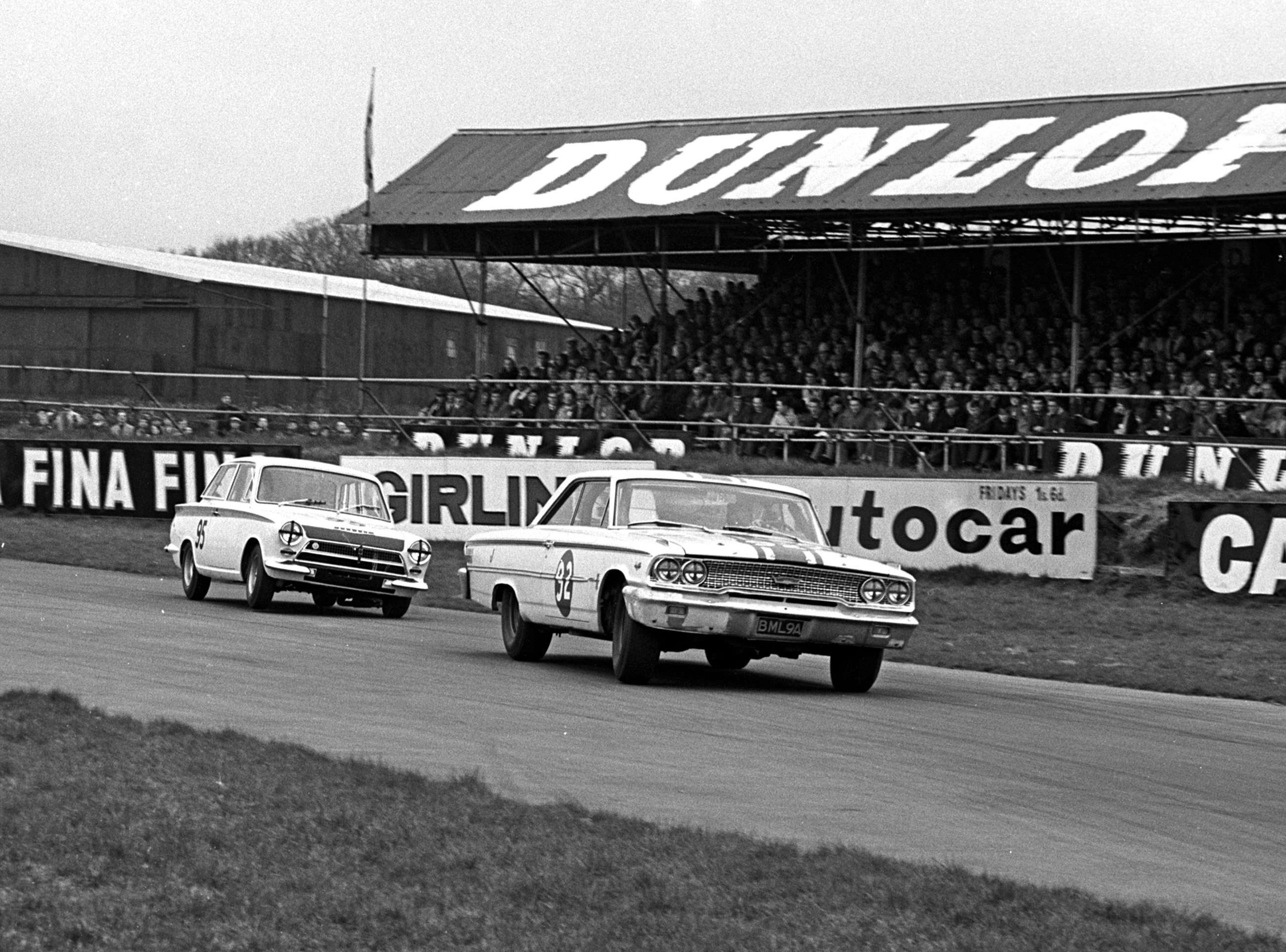 Battle royal - Jack Sears in the Willment Galaxie versus Jim Clark in the works Lotus-Cortinas - Woodcote Corner, Easter Monday Goodwood, 1964