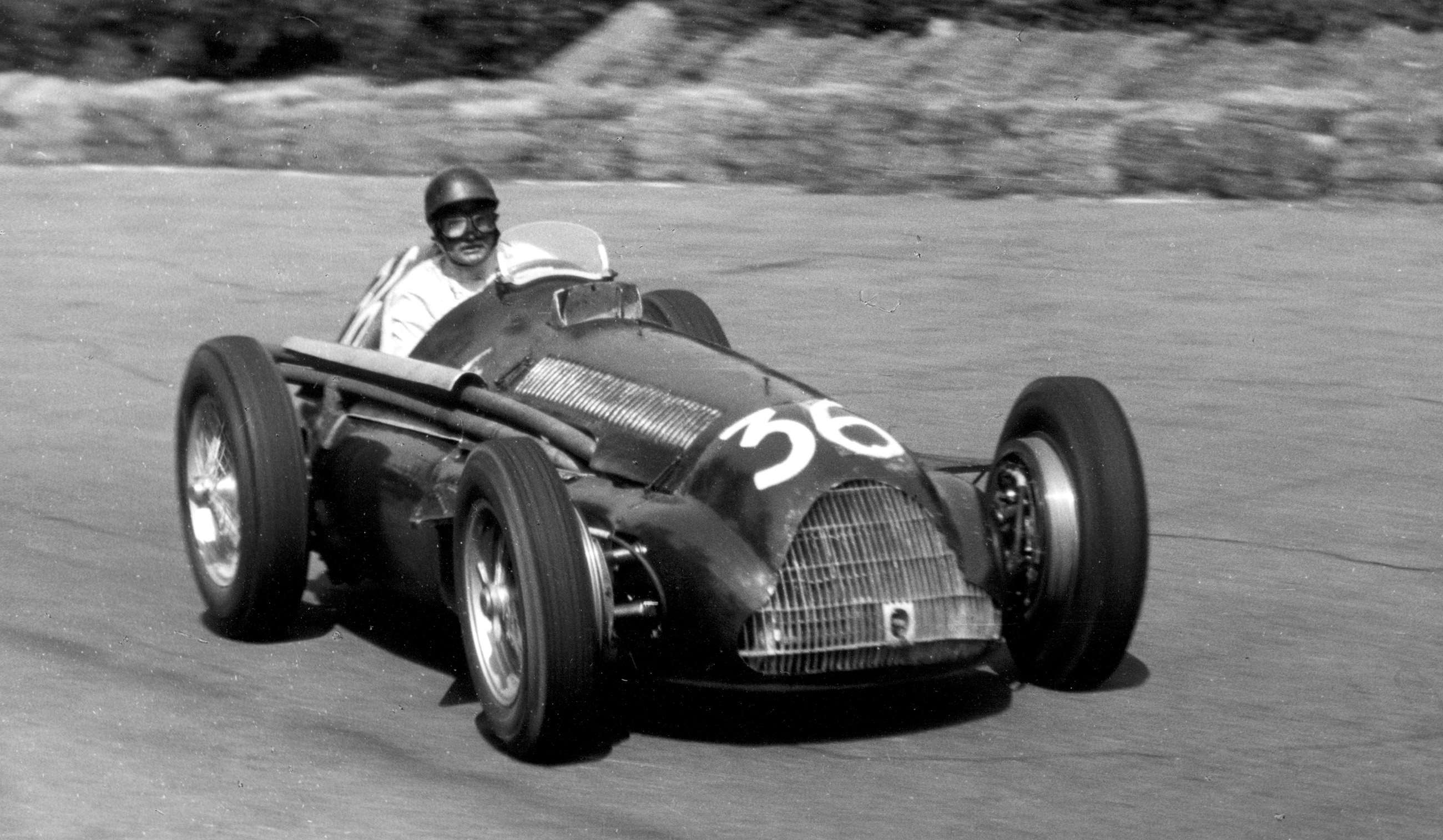 Big and bulky, packed with fuel tanks to feed its 2mpg supercharged engine - the Alfetta in its final form as the Alfa Romeo 159 - Swiss Baron ‘Toulo’ de Graffenried driving, 1951 Italian GP at Monza.