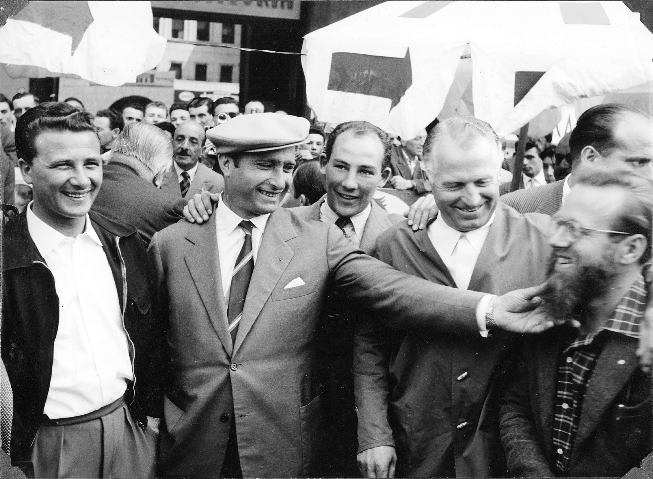 Hugely admired, respected and genuinely liked - five-time World Champion Driver Juan Manuel Fangio larking about with his Mercedes-Benz team-mates before the 1955 Mille Miglia - left to right; cadet driver Hans Herrmann, Fangio, Stirling Moss, Karl Kling and Stirling’s navigator, bearded Denis Jenkinson of ‘Motor Sport’ magazine