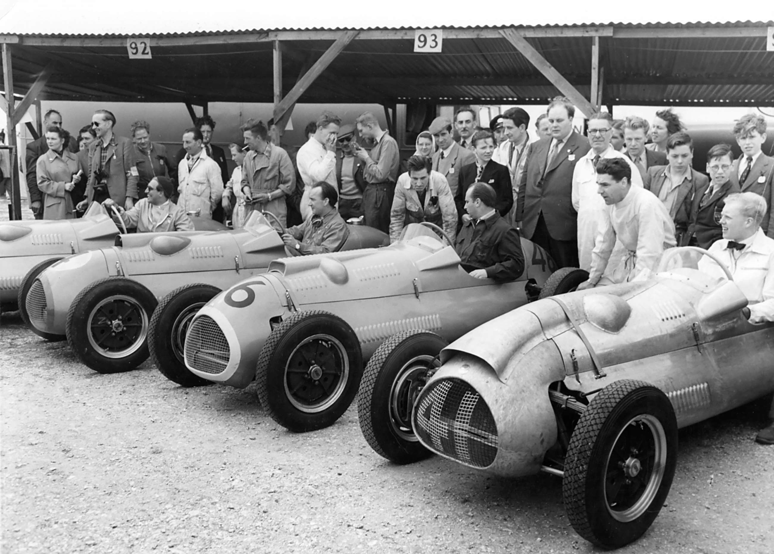 The front-engined new water-cooled Cooper-Bristol F2 cars at Goodwood, Easter Monday 1952. Left to right, Alan Brown, Eric Brandon, Juan Manuel Fangio and newcomer Mike Hawthorn - who will beat them all...