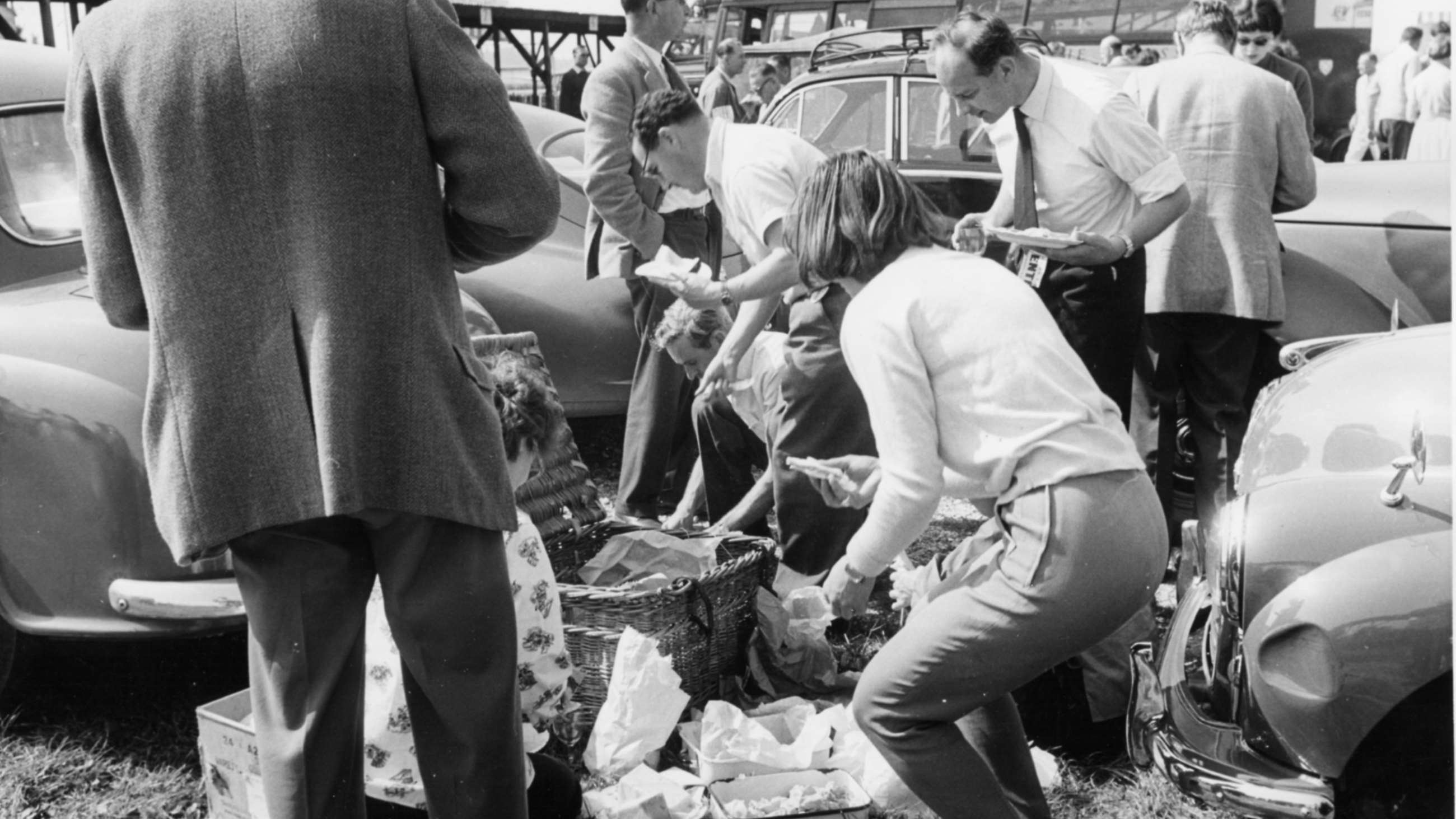 The contemporarily far more usual picture of girls’ activities in the Goodwood paddock of the 1950s - presiding over the picnic lunch...