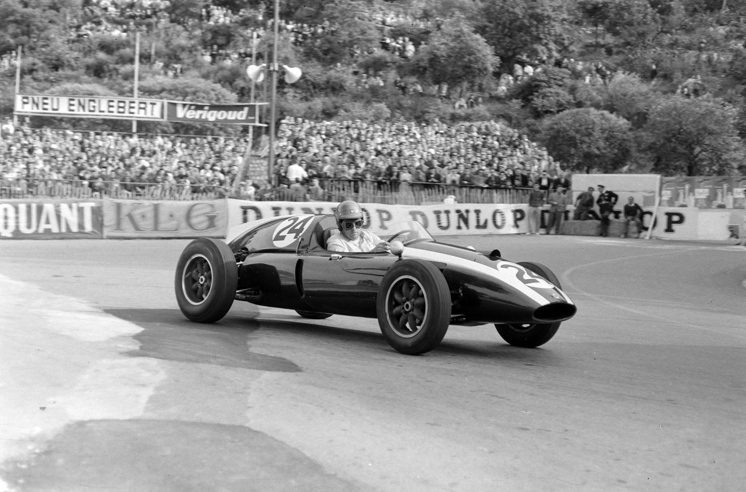 Spectators watch on as Jack Brabham drives his Cooper T51 in Monaco, 1959.