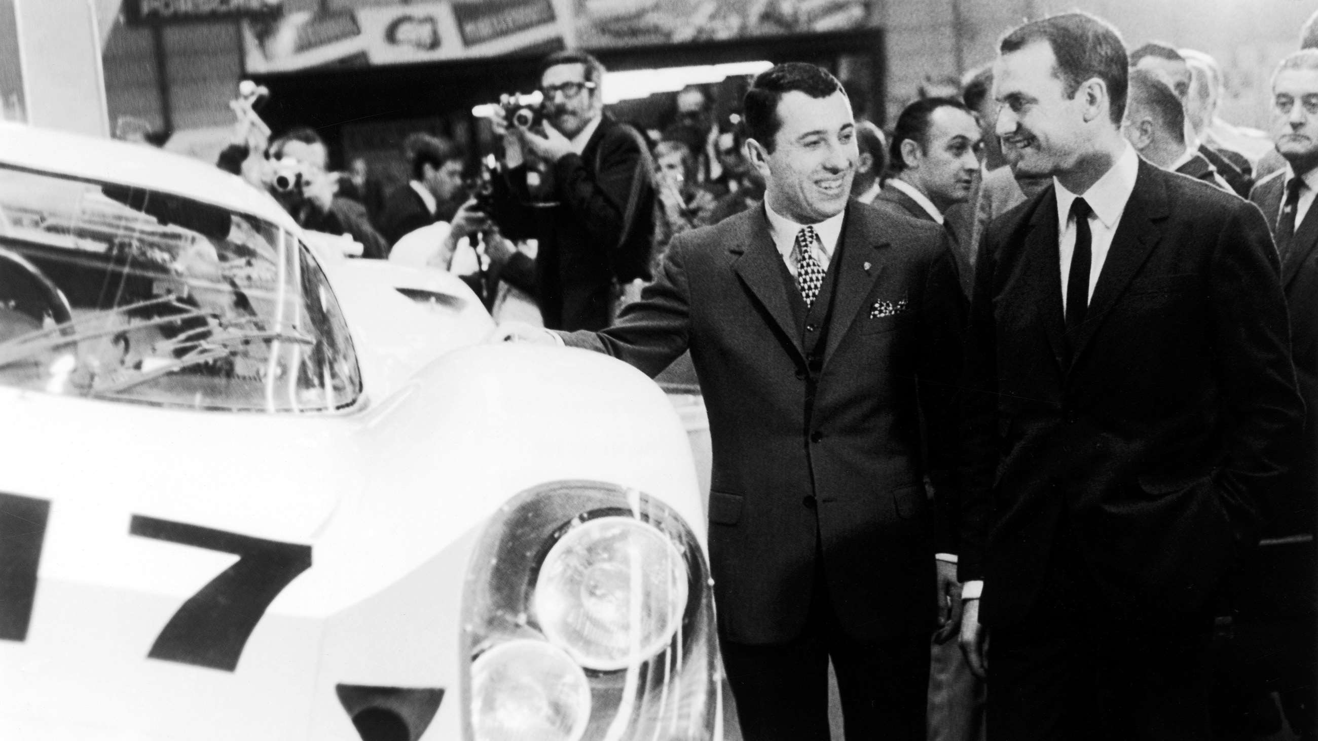 Above, Piëch (right) with Gerhard Mitter at the reveal of the Porsche 917, Geneva, 1969. Top image, Piëch (right), with grandfather Ferdinand Porsche (centre) and Ferdinand Alexander Porsche (left).