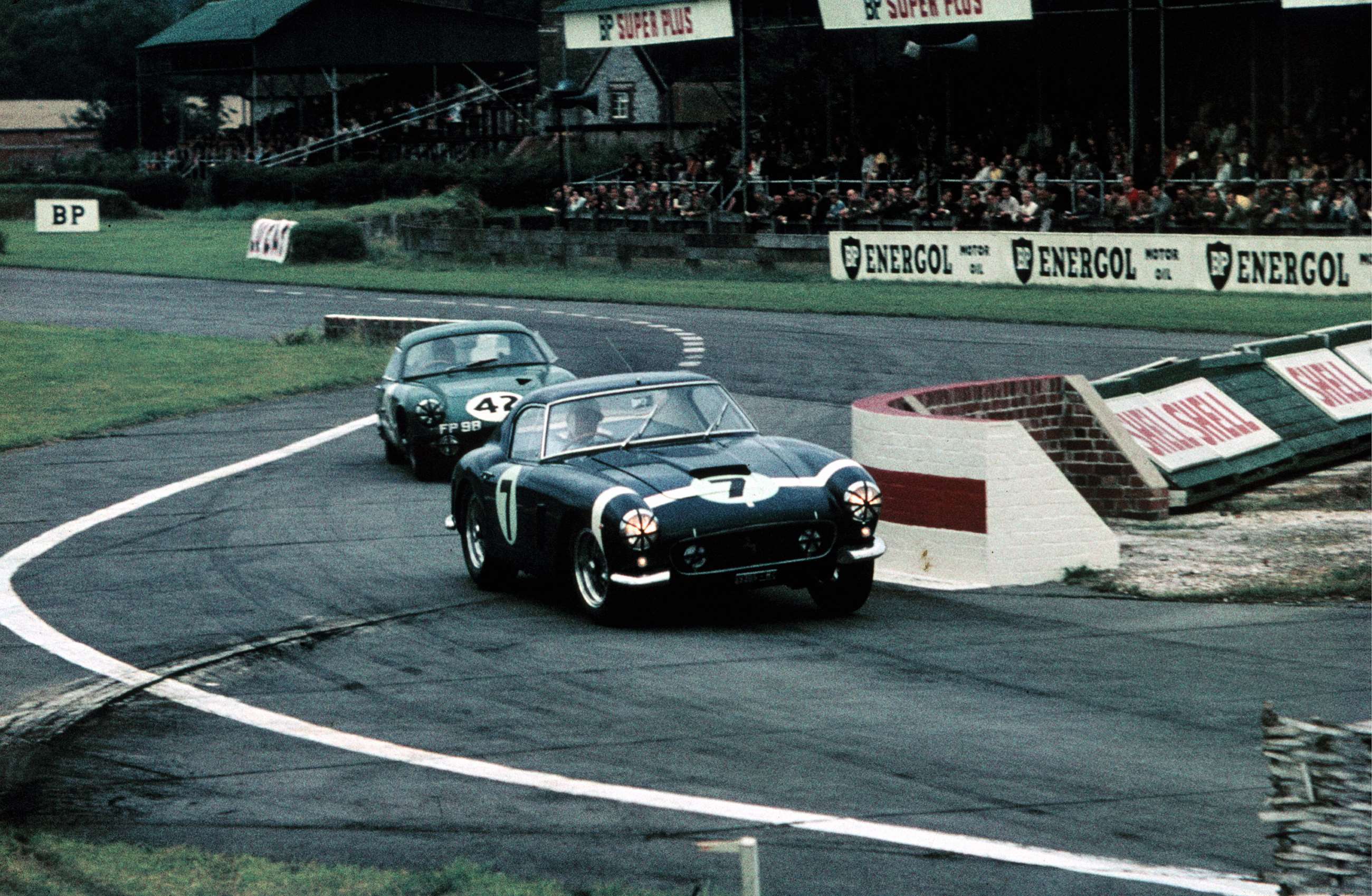 Stirling Moss racing the iconic No.7 Ferrari 250 GT SWB at Goodwood