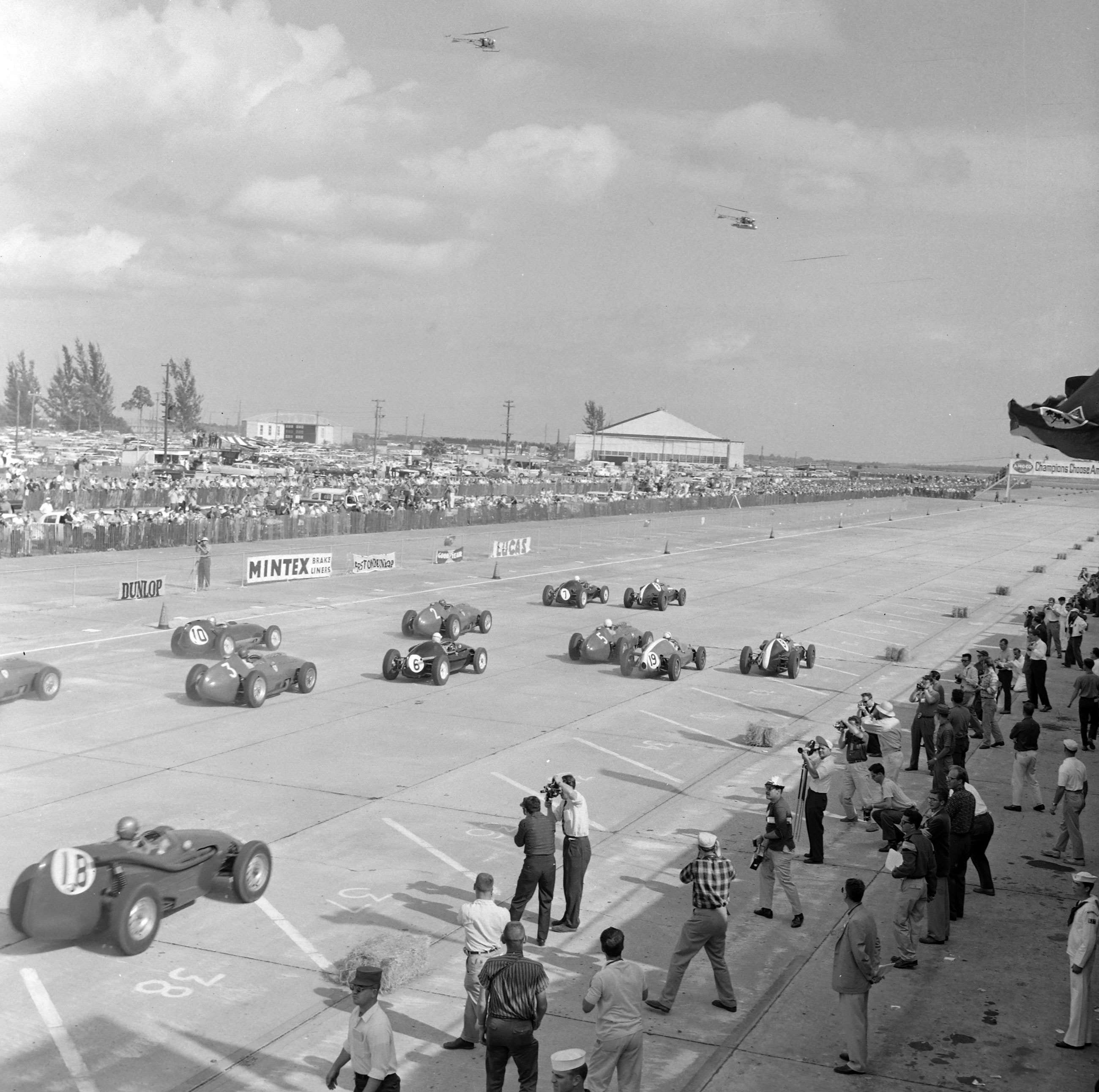 The start of the 1959 US Grand Prix at Sebring. Jack Brabham in his Cooper T51 Climax leads away at the start from Stirling Moss. 