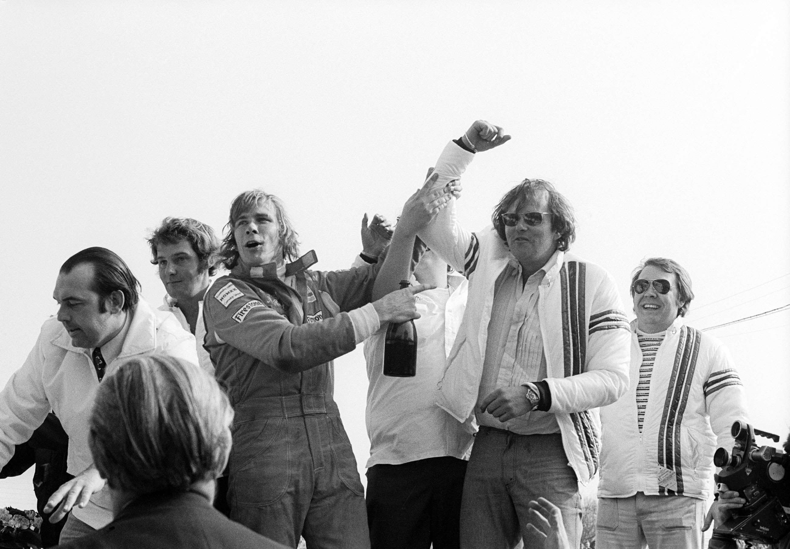 Hunt having won the non-championship F1 race at Silverstone, celebrating with team boss Anthony 'Bubbles' Horsely. 