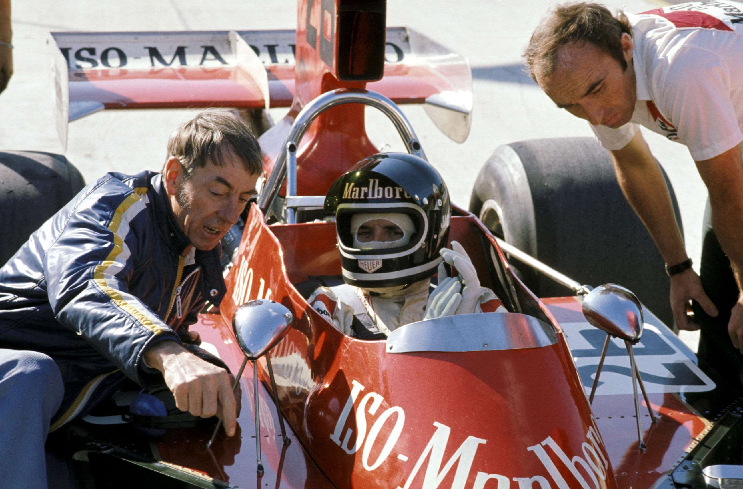 Tauranac with Derek Bell and Frank Williams at the 1973 US Grand Prix. 