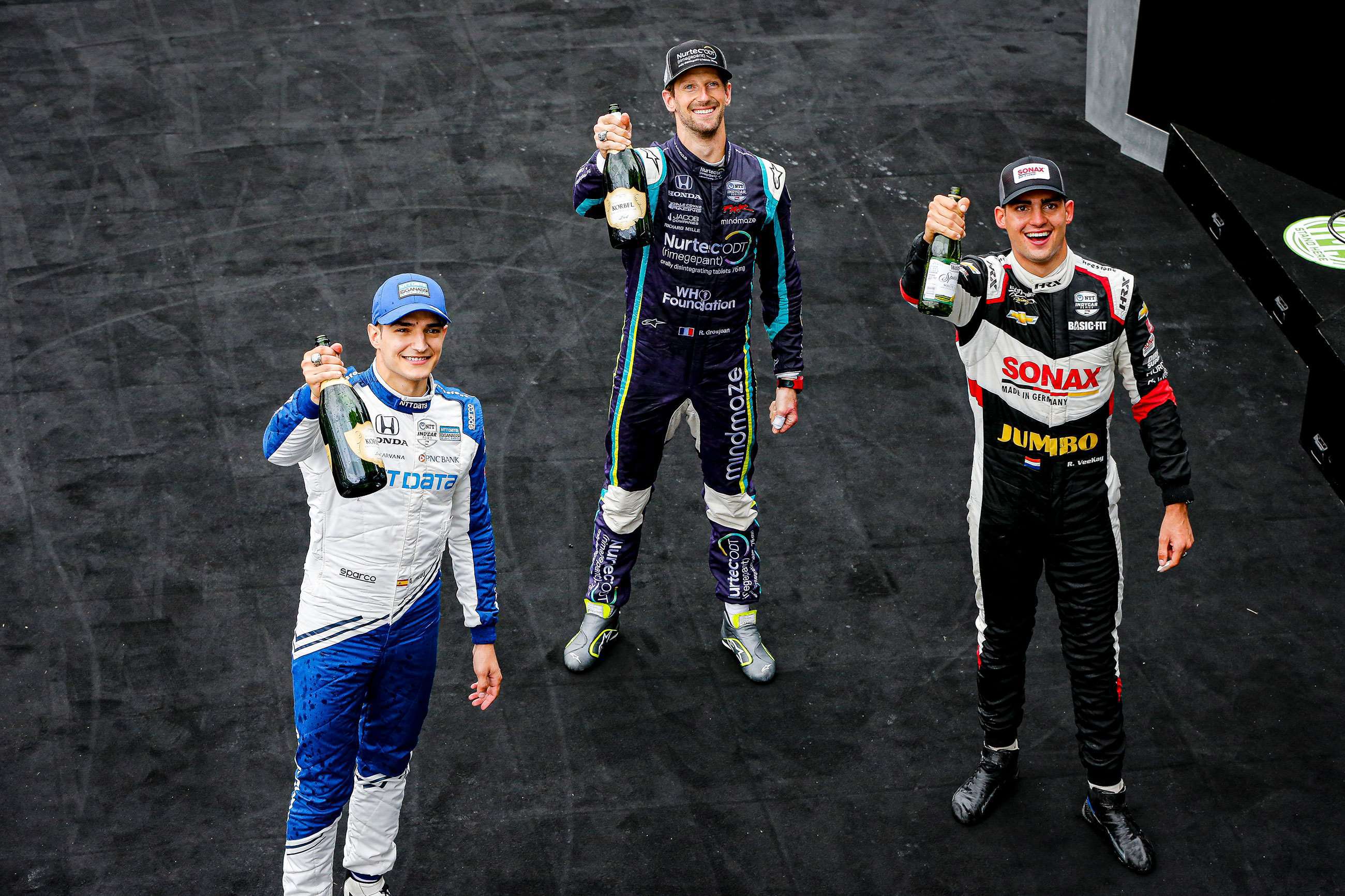 Left to right, Alex Palou, Romain Grosjean and the winner, Rinus VeeKay. 