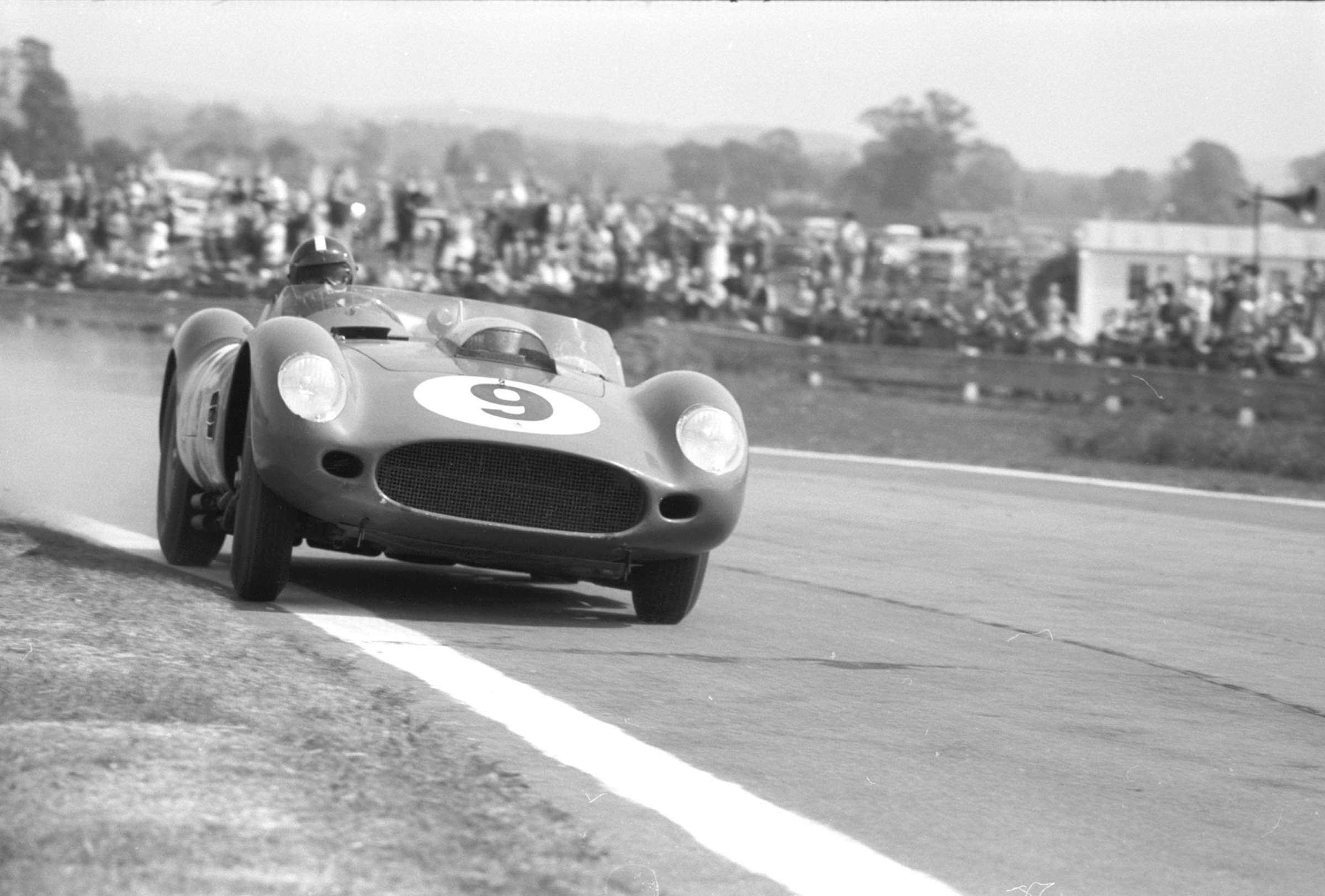 Dan Gurney driving a Ferrari 250 TR59 at Goodwood in 1959