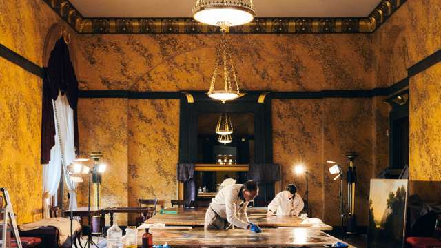 Our painting conservator, Ying Yang restoring five 17th century paintings in the Egyptian Dining Room in January 2023